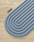 Hercule Studio Galé blue jean pad in lifestyle Pilates class, 3-in-1 blue mini mat for sensitive area support, portable accessory made in France