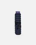 Hercule Studio Galé pad – navy blue portable 3-in-1 mini mat – convenient for transport and travel, suitable for Pilates/Reformer, durable French design, rolled view with logo ribbon