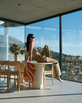 Lifestyle with Galé Hercule Studio Bari Ergonomic Mat in Pop Orange, a compact mini mat for floor exercises and yoga