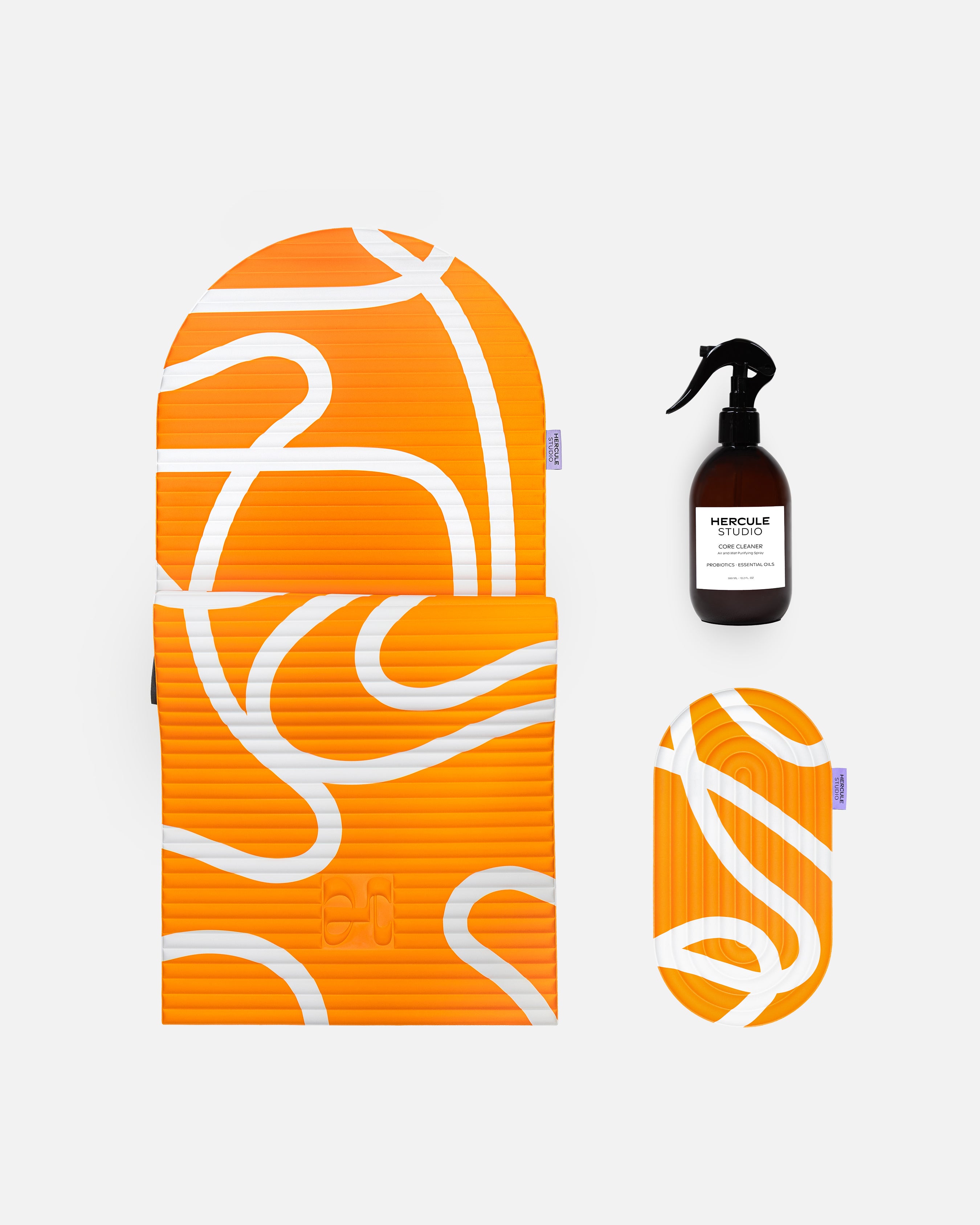 Hercule Studio Bari Orange Pop printed essential bundle with the graphic Archy mat, the Galé 3-in-1 comfort pad and the sport mat sanitizing spray, design and responsible Pilates bundle made in France, product packshot