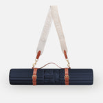 Hercule Studio navy blue nomad bundle with the design Archy mat and a mat carrying strap for sport mats, lightweight and elegant bundle for Pilates and fitness on the move, made in France, packshot