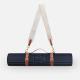Hercule Studio navy blue nomad bundle with the design Archy mat and a mat carrying strap for sport mats, lightweight and elegant bundle for Pilates and fitness on the move, made in France, packshot