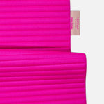 Détail étiquette personnalisée Hercule Studio x From Future sur tapis de sport en cachemire Candy Pink, finition premium