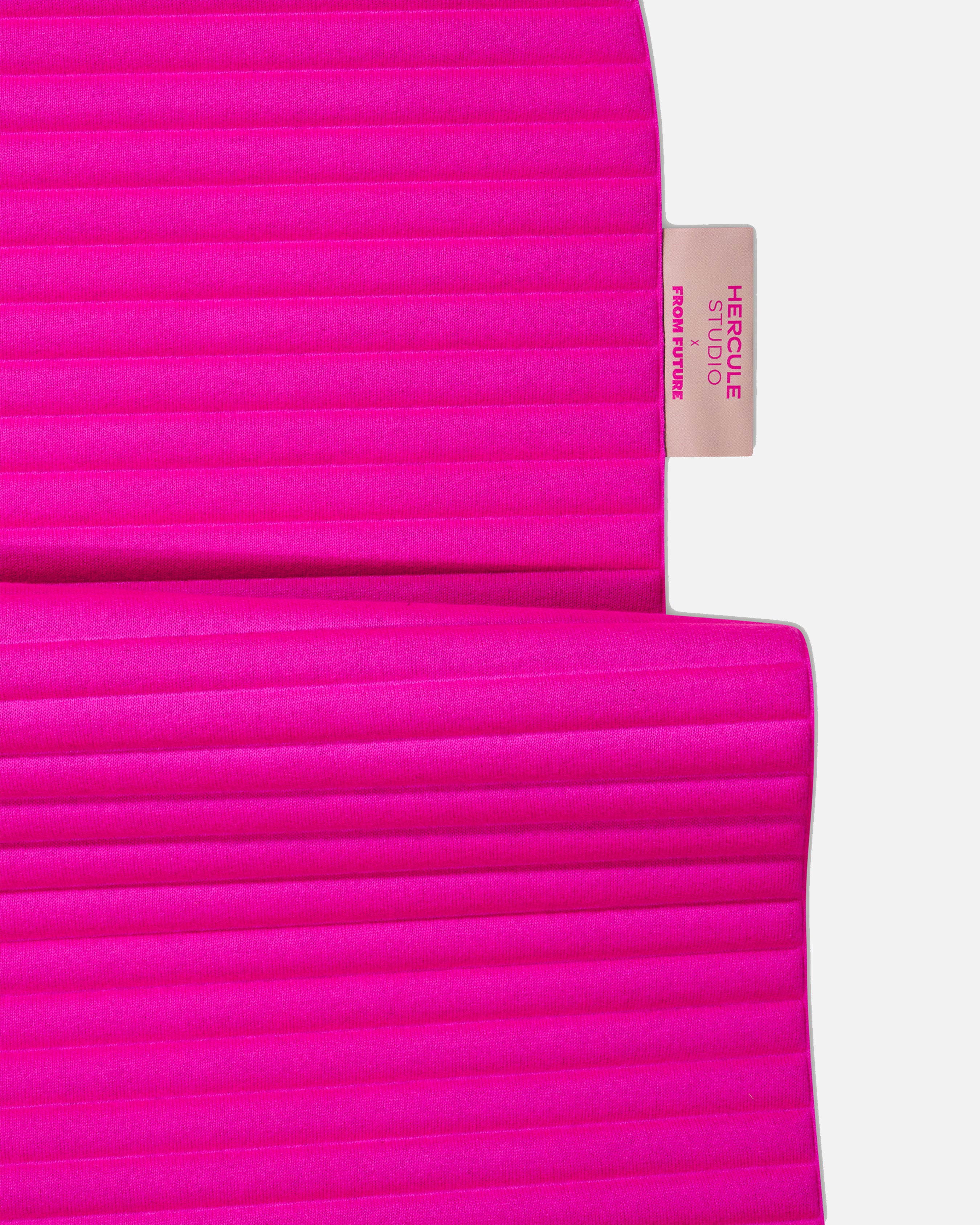 Custom Hercule Studio x From Future label detail on the Candy Pink cashmere sport mat, premium finish