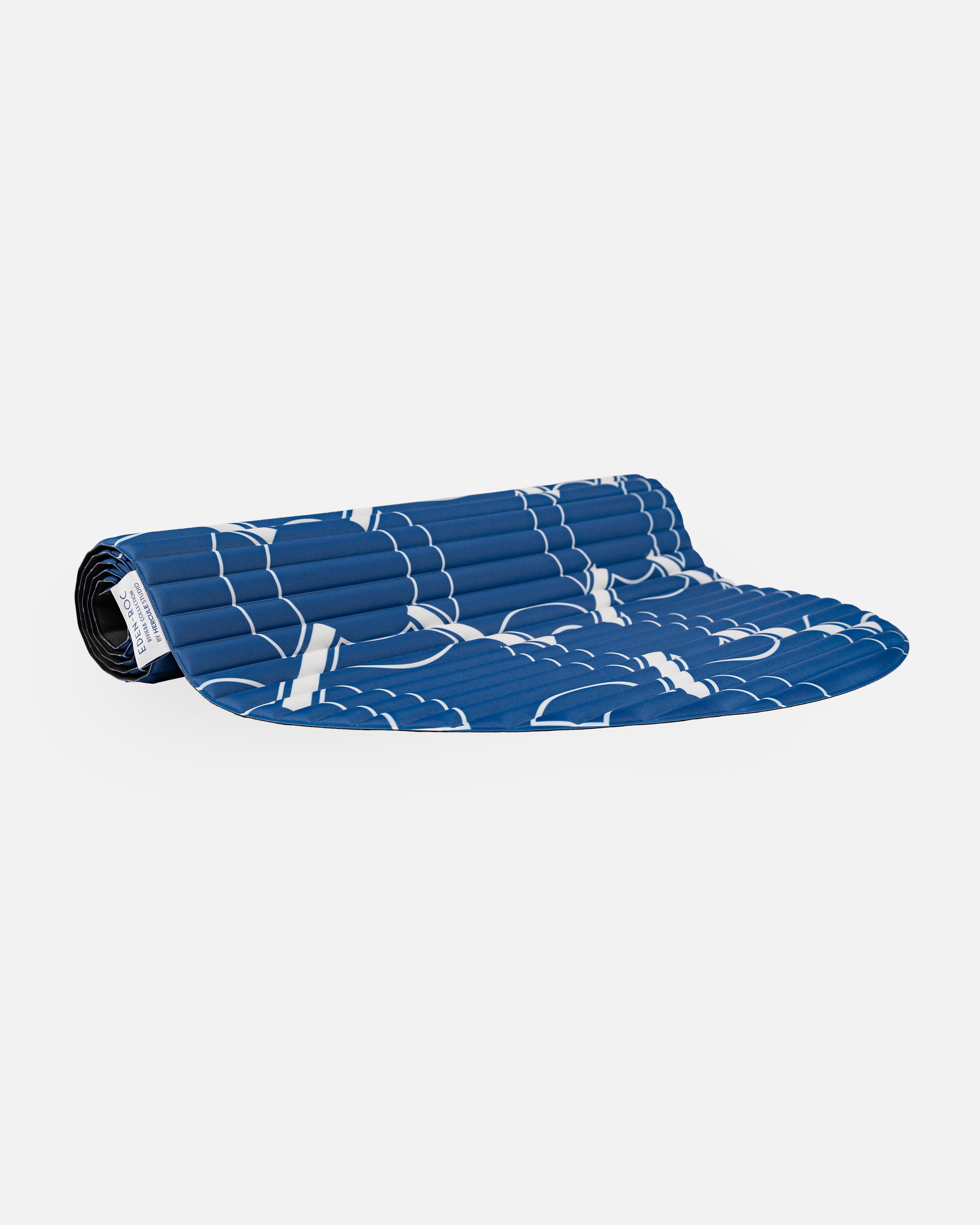 Hercule Studio Archy blue Eden roc monogram arch-shaped sport mat in limited edition, durable mat for Pilates and fitness, made in France, half rolled view