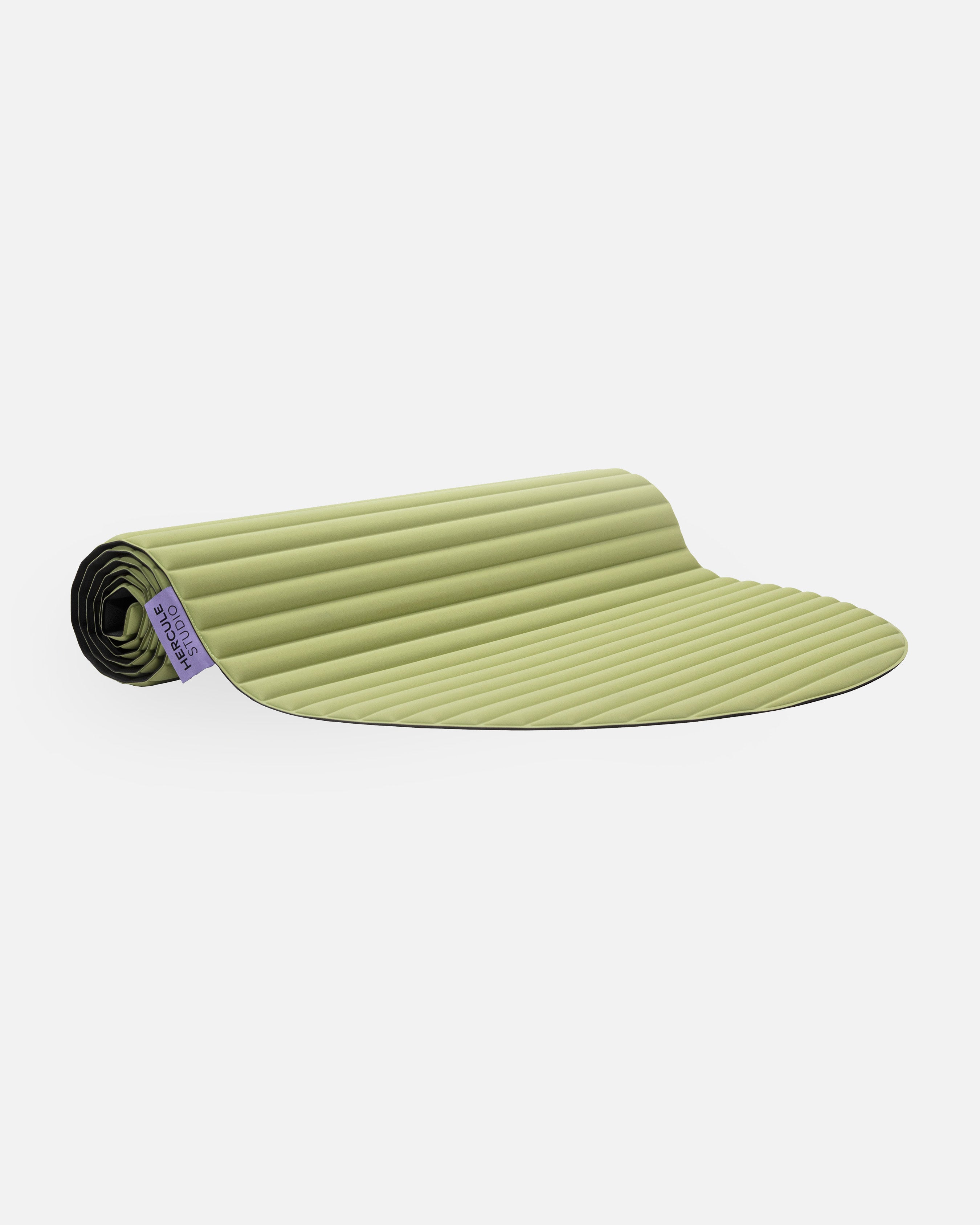 Hercule Studio Archy pistachio green design sport mat, durable mat for fitness and Pilates, half rolled view