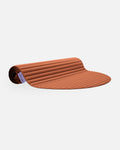 Hercule Studio Archy terracotta design sport mat, durable machine-washable mat for fitness and Pilates, half rolled view