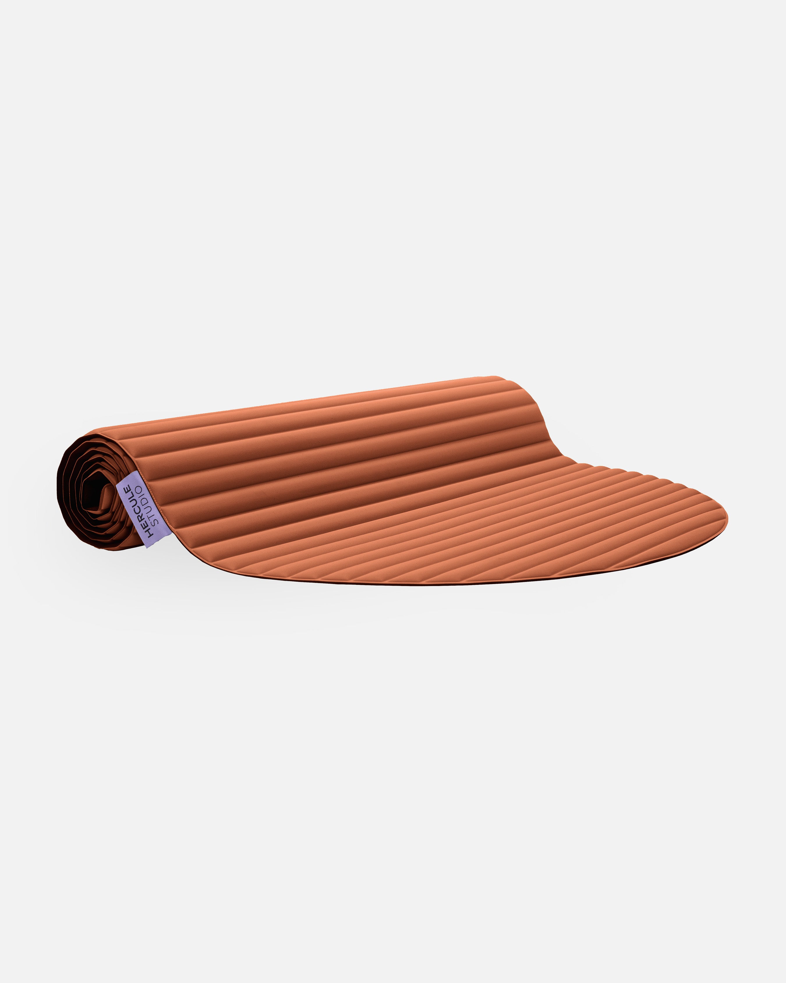 Hercule Studio Archy terracotta design sport mat, durable machine-washable mat for fitness and Pilates, half rolled view