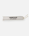 Hercule Studio white fabric dust bag, protective cover with black logo for transport and storage of the Mar yoga mat