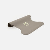 Half-rolled view of the Hercule Studio Greige yoga mat, PVC-free, eco-friendly, comfort and performance for all postures