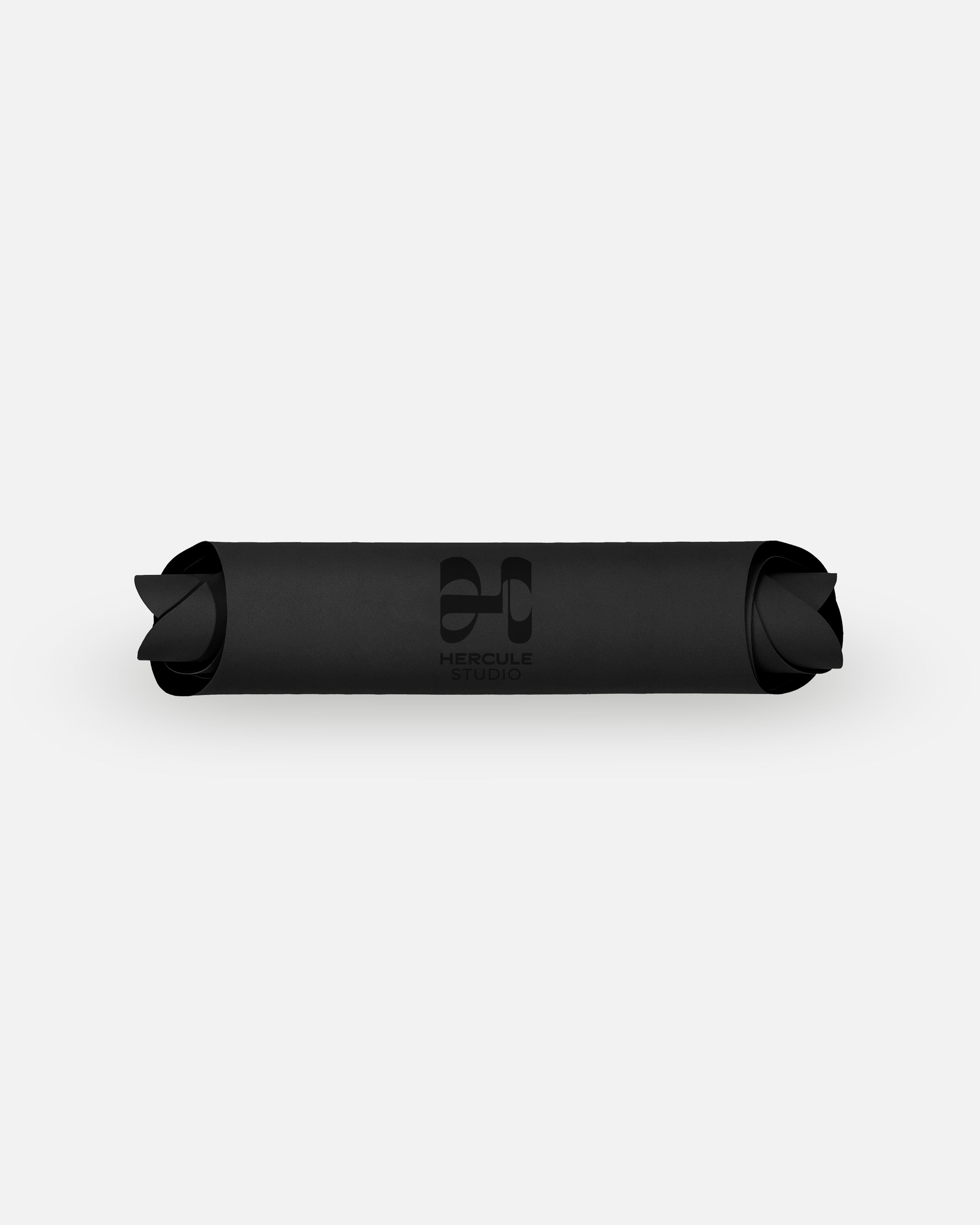 Packshot of the rolled Hercule Studio Midnight Black mat, extreme grip and durable eco-designed natural rubber material