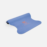 Half-rolled view of the Hercule Studio Thomas Lélu design yoga mat, limited edition quote mat, durable suede material