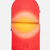 Hercule Studio x Univers Uchronia arch-shaped sport mat, Archy Summer red and yellow printed model, durable Made in France design mat for fitness, Pilates and stretching, half unrolled view