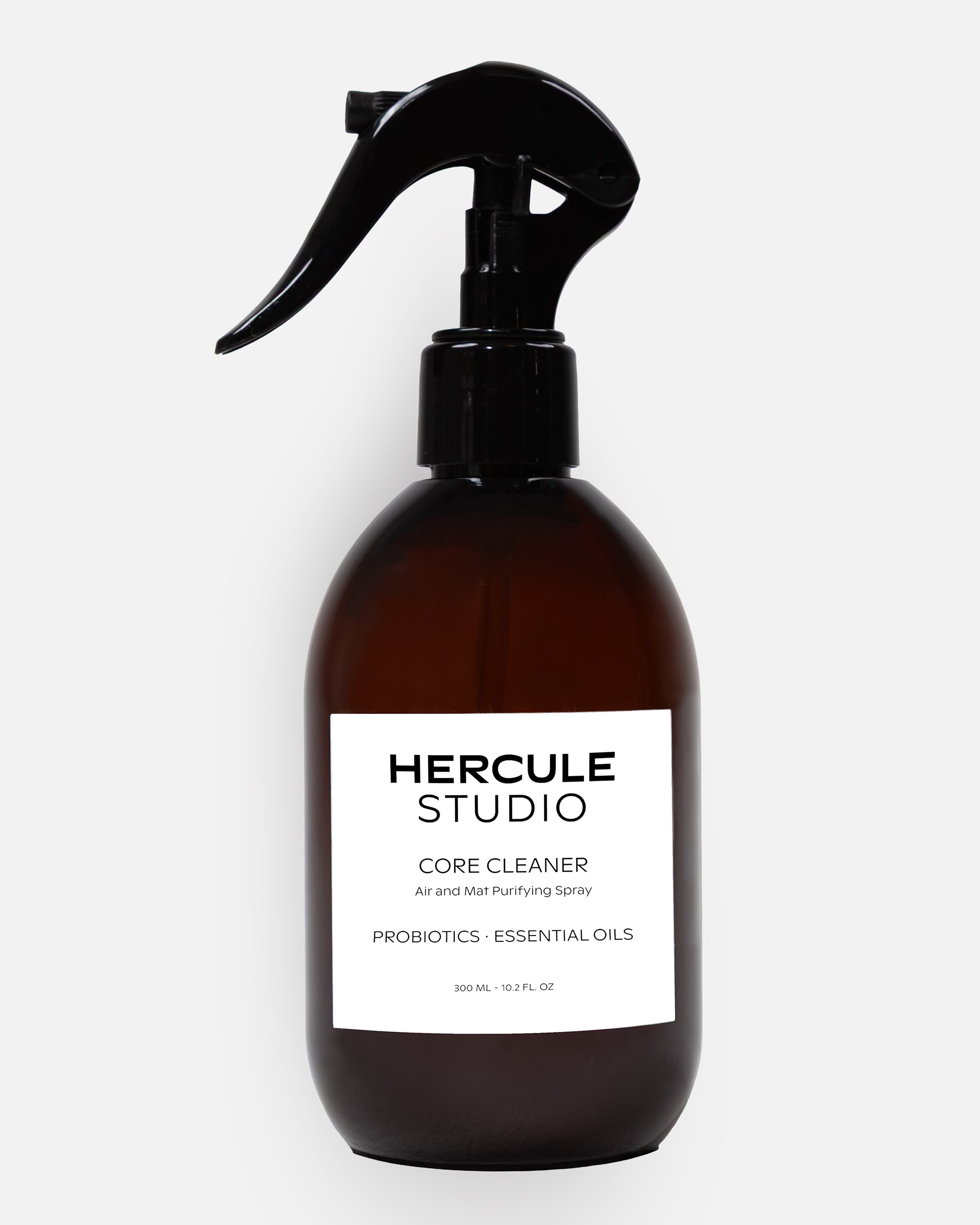 Hercule Studio Probiotic-Enriched Sanitizing Spray for Exercise Mats, a stylish 2-in-1 bottle designed to clean yoga and fitness mats and create an energizing atmosphere, made in France